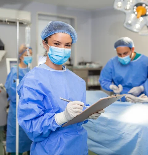 surgeon-writing-clipboard-operation-room-anaesthesiologist-writing-updates